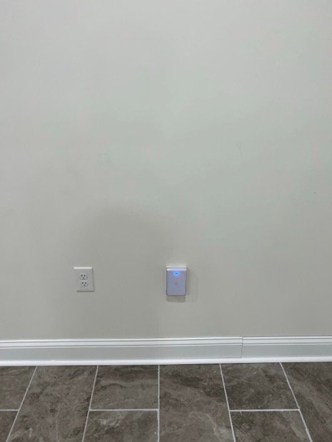 In-wall access point set flush at outlet height &mdash; coverage without another box on the ceiling.