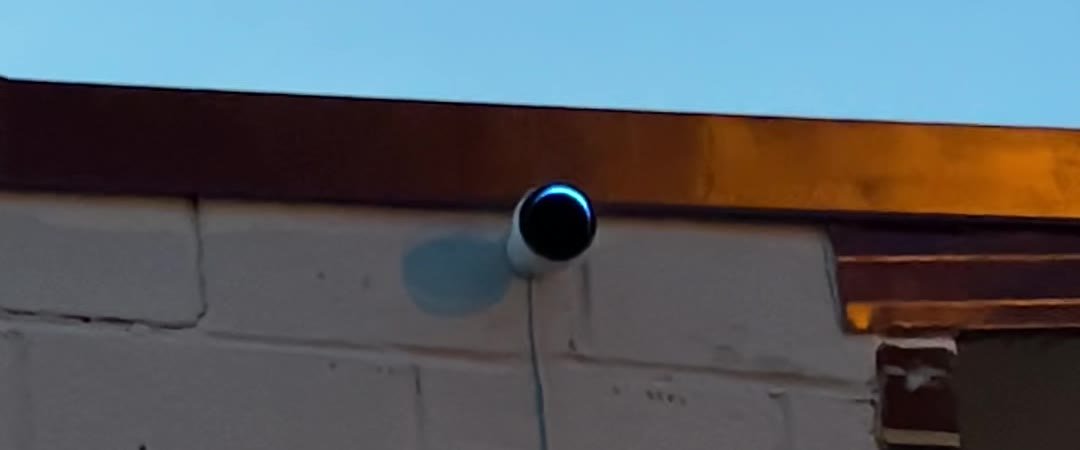 Perimeter camera mounted at the roofline of a commercial building